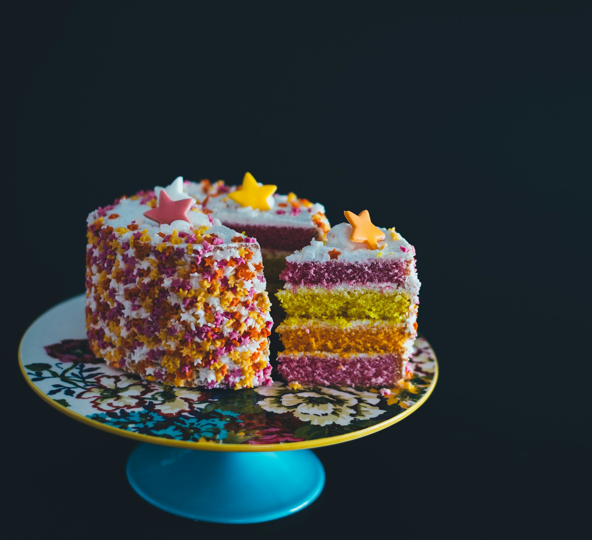 A decorated cake topped with berries
